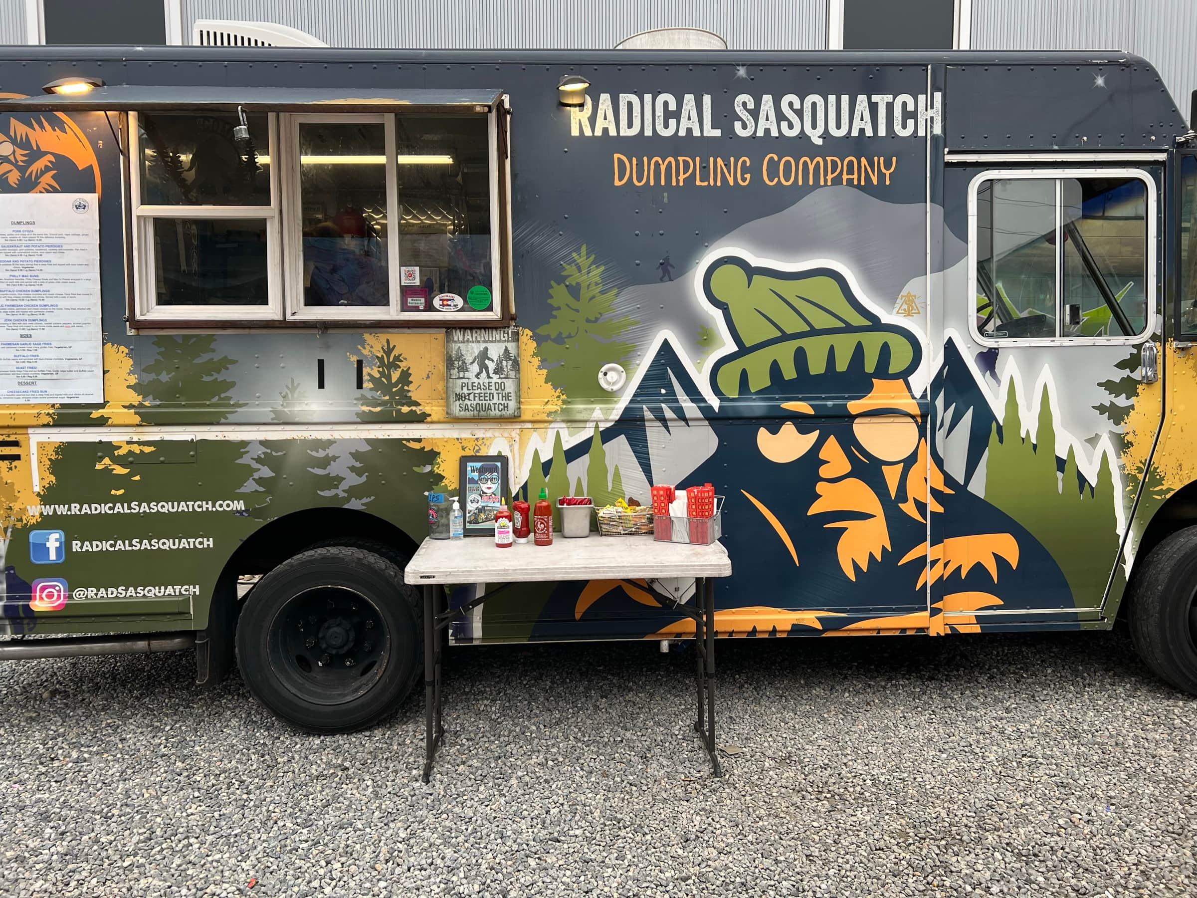 The Radical Sasquatch truck, its Sasquatch mural and the condiment table